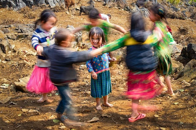 kids playing a game after watching a school assembly program.